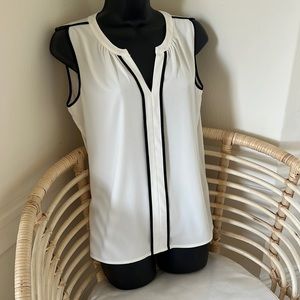 Calvin Klein iconic white work top! This one is never worn. White/ black piping.
